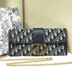 30 Montaigne Jacquard Canvas Clutch Bag Blue