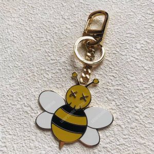 Dior x Kaws Bee Key Ring In Brass & Resin - Image 3