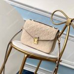 LV Pochette Metis Monogram Empreinte Leather Creme